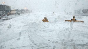 Snowplows clear the runway of snow at LaGuardia Airport in New York, U.S., March 14, 2017. REUTERS/Shannon Stapleton