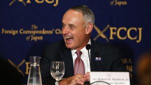 Major League Baseball Commissioner Rob Manfred laughs during a press conference in Tokyo, Tuesday, March 7, 2017. Manfred denied reports Tuesday that 2017 would be the last edition of the World Baseball Classic, saying the tournament is as popular as ever. The fourth edition of the tournament run by MLB and the players' association began in Seoul on Monday. Japan will kick off its campaign on Tuesday against Cuba at Tokyo Dome. (AP Photo/Toru Takahashi)