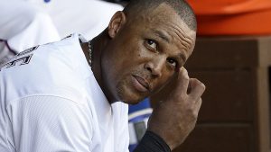 Texas Rangers' Adrian Beltre, front, and Ian Desmond, rear, sit in the dugout during the fifth inning of Game 1 of baseball's American League Division Series, against the Toronto Blue Jays, on Thursday, Oct. 6, 2016, in Arlington, Texas. (AP Photo/David J. Phillip)