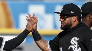 Chicago White Sox second baseman Tyler Saladino, left, celebrates with left fielder Melky Cabrera, center, after their win over the Minnesota Twins, Saturday, April 8, 2017, in Chicago. (AP Photo/Kamil Krzaczynski)