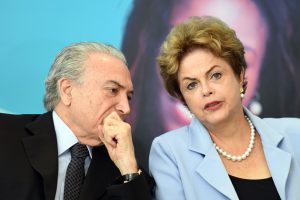 (FILES) This file photo taken on August 11, 2015 shows Brazilian President Dilma Rousseff (R) and Vice-President Michel Temer attending the launching ceremony of the Investment Program in Energy at Planalto Palace in Brasilia.
Brazil's Supreme Electoral Court met on April 4, 2017 on whether to invalidate the 2014 presidential election because of illegal campaign funding -- a ruling that could in theory force out President Michel Temer. At issue are allegations that when then president Dilma Rousseff ran for re-election in 2014, with Temer as vice president, their ticket was financed by undeclared funds or bribes. Both Temer and Rousseff deny any wrongdoing. / AFP PHOTO / EVARISTO SA