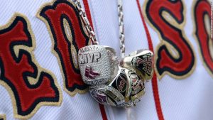 BOSTON, MA - APRIL 4:  David Ortiz #34 of the Boston Red Sox wears a necklace containing his 2004, 2007 and 2013 championship rings along with a ring honoring his 2013 World Series MVP selection during a ceremony honoring the 2013 World Series Champion Boston Red Sox before the start of a game against the Milwaukee Brewers at Fenway Park on April 4, 3014 in Boston, Masschusetts.  (Photo by Michael Ivins/Boston Red Sox/Getty Images)