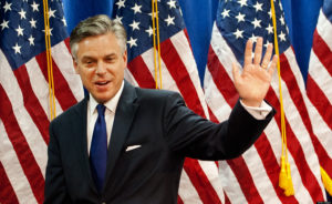 Former Utah Gov. Jon Huntsman waves to a room full of reporters as he leaves after anouncing the suspension of his campaign for the GOP presidential nomination January 16, 2012 and endorses Mitt Romney at the Myrtle Beach Convention Center in Myrtle Beach, South Carolina. Huntsman, the former US ambassador to China, ended his struggling presidential bid Monday and called on Republicans to unite in support of frontrunner Mitt Romney.  AFP Photo/Paul J. Richards (Photo credit should read PAUL J. RICHARDS/AFP/Getty Images)
