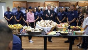 President Donald Trump, with first lady Melania Trump, speaks with members of the U.S. Coast Guard, at the Lake Worth Inlet Station, on Thanksgiving, Thursday, Nov. 23, 2017, in Riviera Beach, Fla. (AP Photo/Alex Brandon)