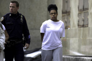 Tiona Rodriguez, 17, going into Manhattan Central booking for arraignment, saturday morning.  After an arrest for shoplifting at Victoria's Secret in midtown, police found a male fetus in her bag. photo William Farrington