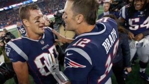 Mandatory Credit: Photo by Michael Dwyer/AP/Shutterstock (9931352dy)
New England Patriots tight end Rob Gronkowski, left, and quarterback Tom Brady speak at midfield after beating the Kansas City Chiefs in an NFL football game, in Foxborough, Mass
Chiefs Patriots Football, Foxborough, USA - 14 Oct 2018