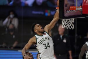 Milwaukee Bucks' Giannis Antetokounmpo (34) dunks in the second half of an NBA conference semifinal playoff basketball game against the Miami Heat Friday, Sept. 4, 2020, in Lake Buena Vista, Fla. (AP Photo/Mark J. Terrill)