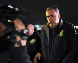 Boston Police Commissioner Ed Davis leaves after speaking to the media as a search for the second of two suspects wanted in the Boston Marathon bombings takes place on April 19, 2013 in Watertown, Massachusetts. A Boston marathon bombing suspect captured by police died in hospital, local television channels reported early Friday. Police have told residents of the town of Watertown near Boston to stay indoors and 